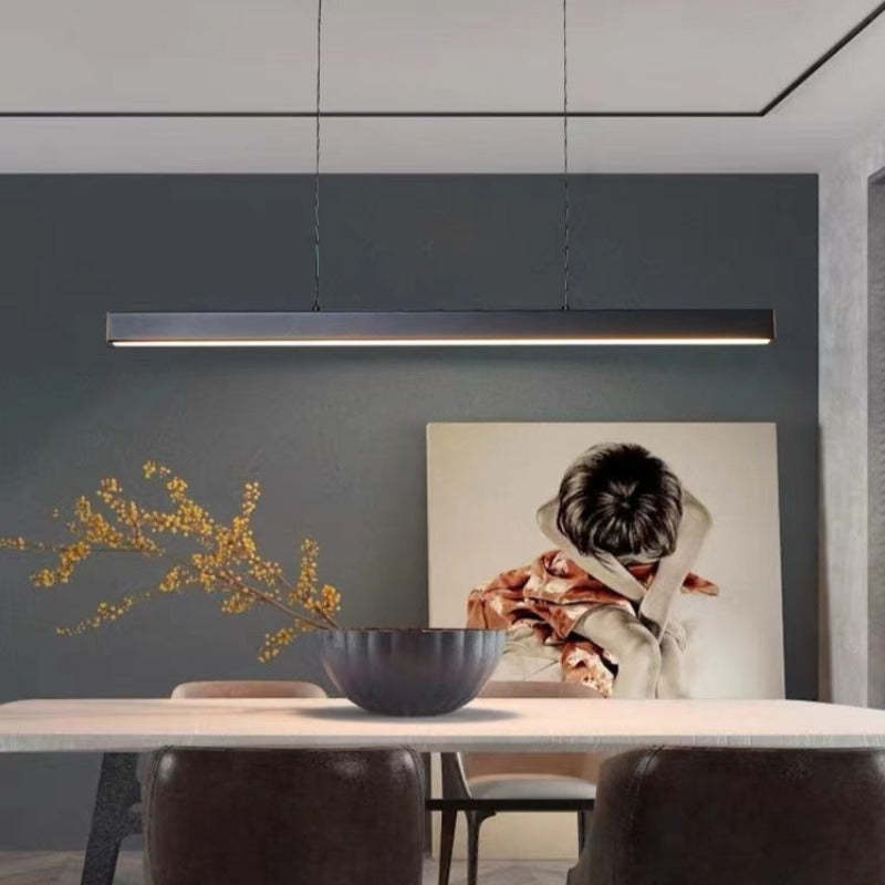 Modern LED linear pendant light in black, ideal for kitchen island task lighting.