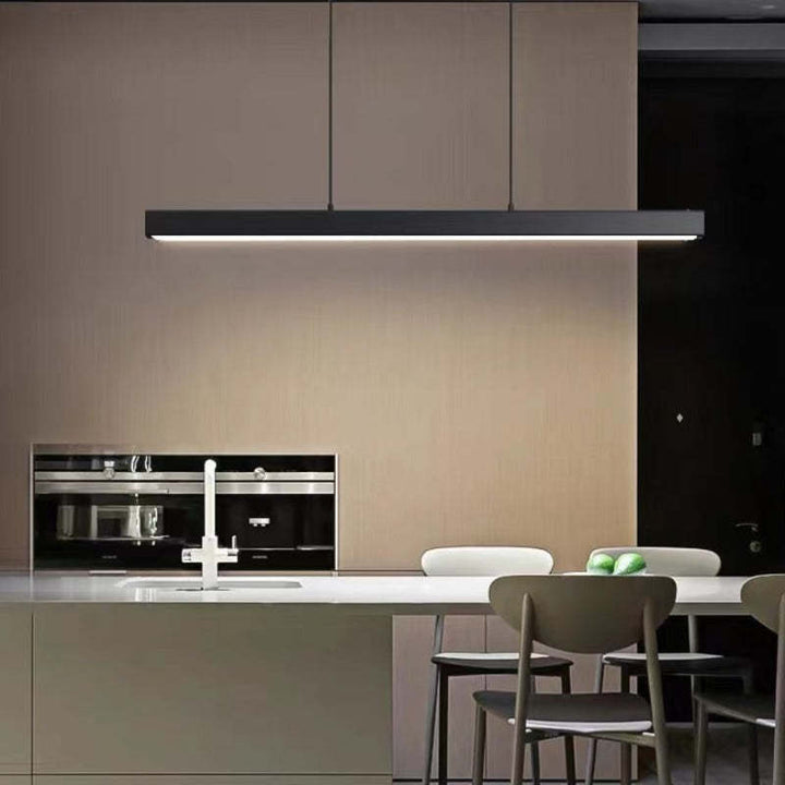 Adjustable modern linear LED pendant light for stylish dining room ambiance.
