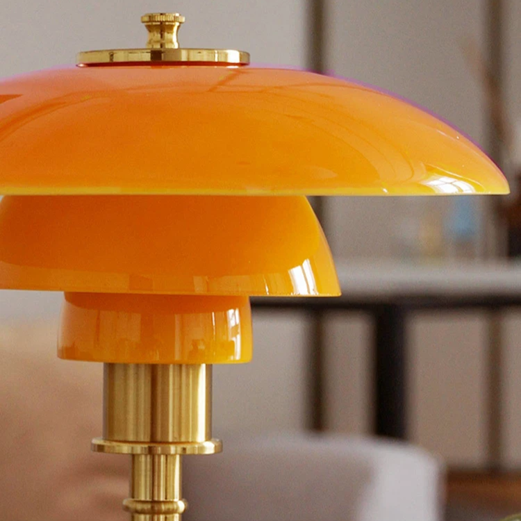 Minimalist Danish LED table lamp with a warm ambient light.