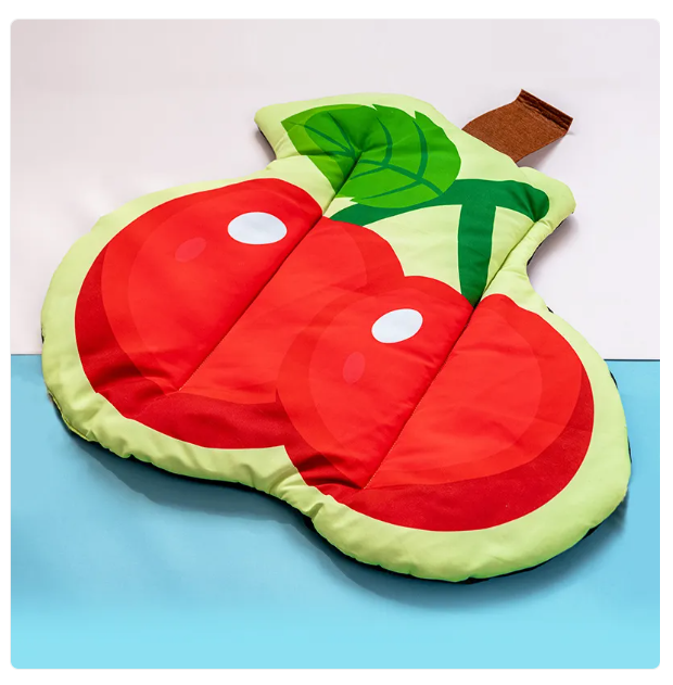 Cooling pet mat for dogs & cats with vibrant fruit design. Provides summer heat relief & comfort for pets.
