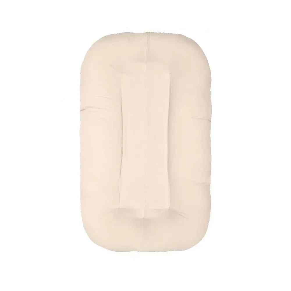 Newborn essential: safe sleep baby bedding in a soft sleeping nest lounger.