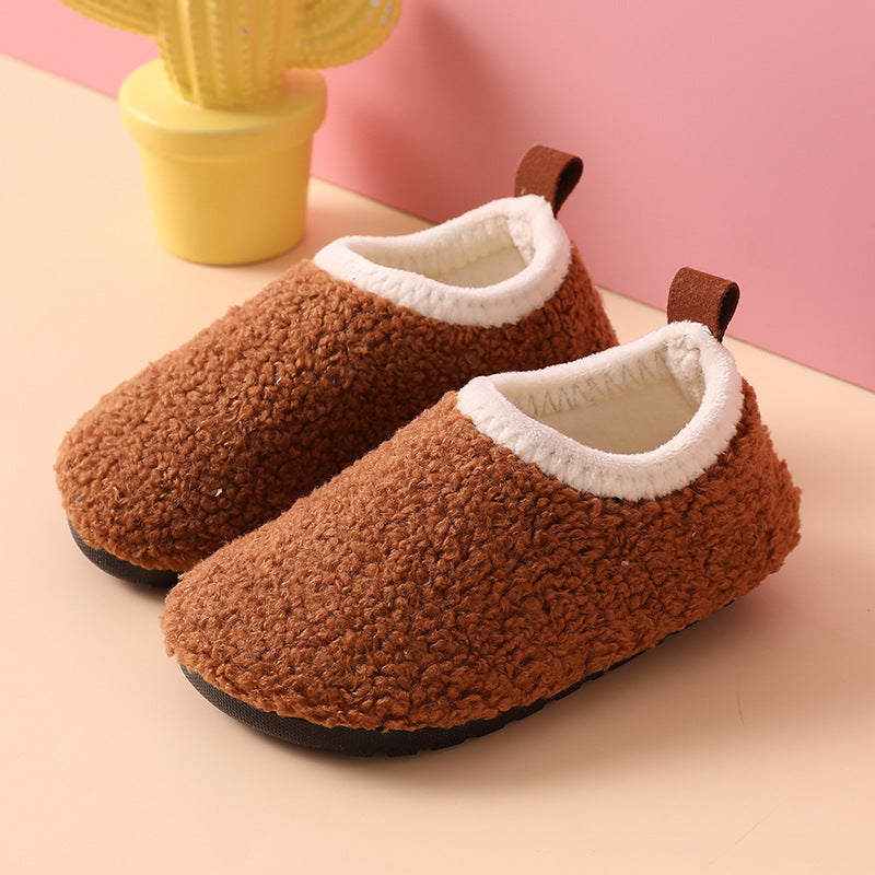 Children's warm slippers with durable non-slip soles, perfect for cozy evenings.