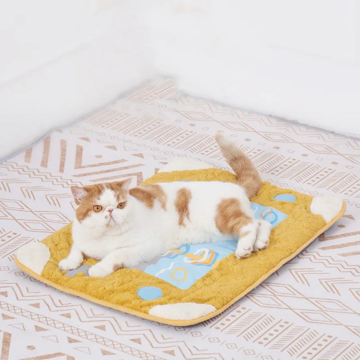 Soft pet sleeping pad for cats, offering ultimate feline comfort with a fun toy.