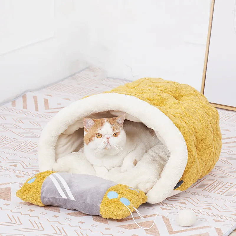 Stylish cat furniture: a cozy cat bed with a soft sleeping pad and playful cat toy.