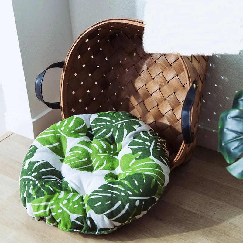 Comfortable cat bed with tropical monstera design. Cozy pet floor cushion providing ultimate animal comfort and style.