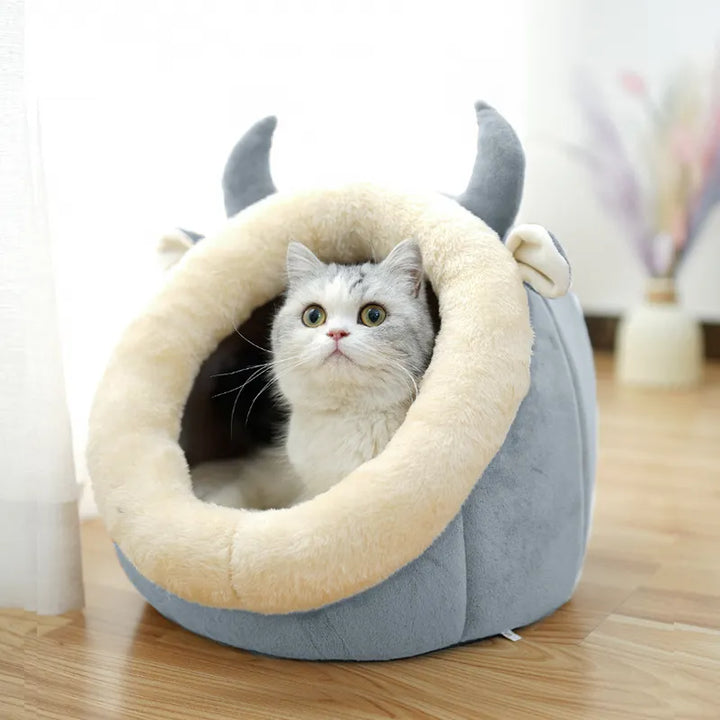 Soft pet bed in a unique cat cave design with ears, perfect for cats to cuddle up and retreat.