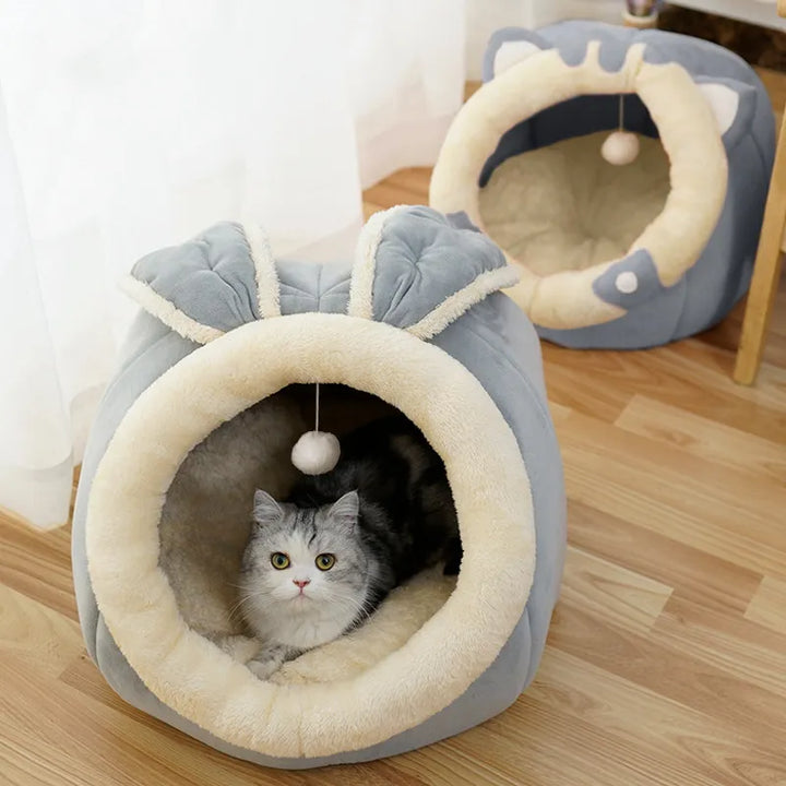 Adorable gray cat bed with ear design, a soft and warm pet retreat for cats and kittens to rest.