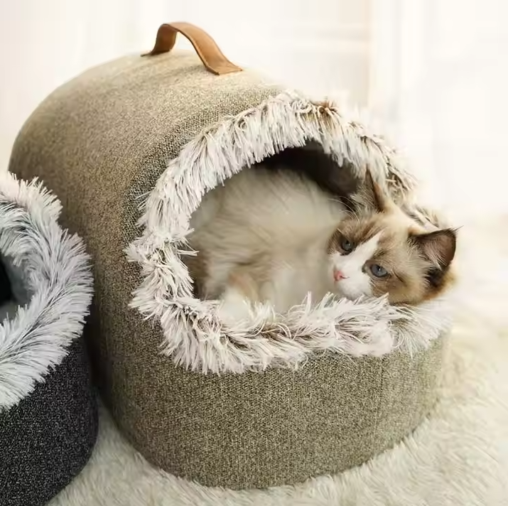 Cozy cat house bed with fluffy edge for ultimate feline comfort and warmth.