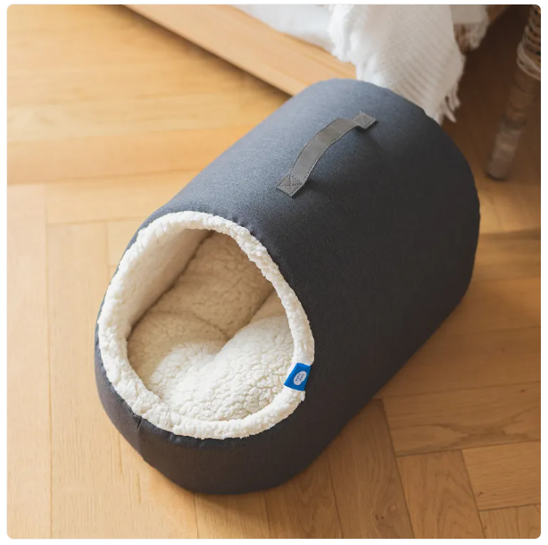 Luxury cat house bed with a soft fluffy edge. Stylish pet furniture for feline comfort.