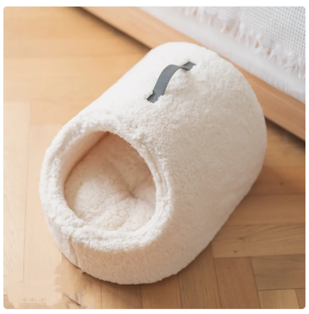 Easy clean, cozy cat house bed with fluffy edge, ensuring superior pet comfort.