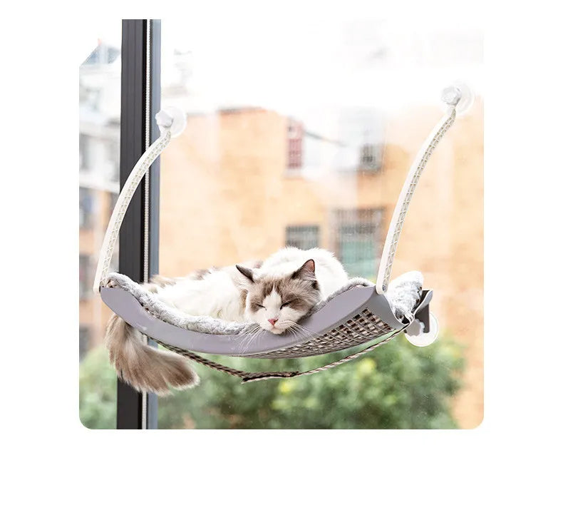 Stable cat window perch with robust suction cups, perfect for elevated sunbathing views.