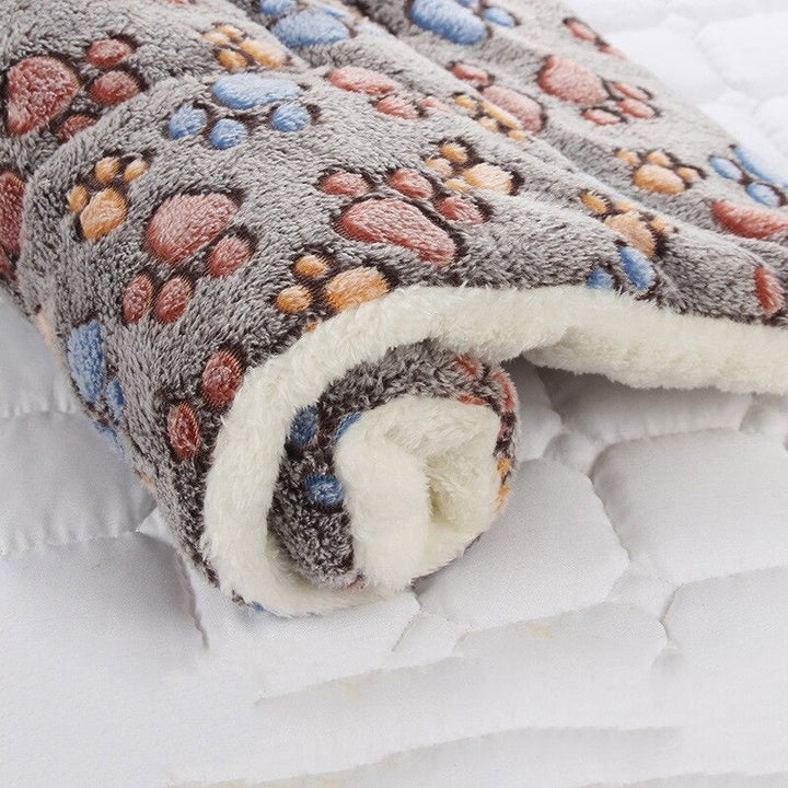 Calming pet bed blanket, creating a secure and cozy space for anxious pets.