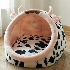 Plush, soft cow cat bed with ears & horns. A comfortable, washable pet bed designed for ultimate feline relaxation.