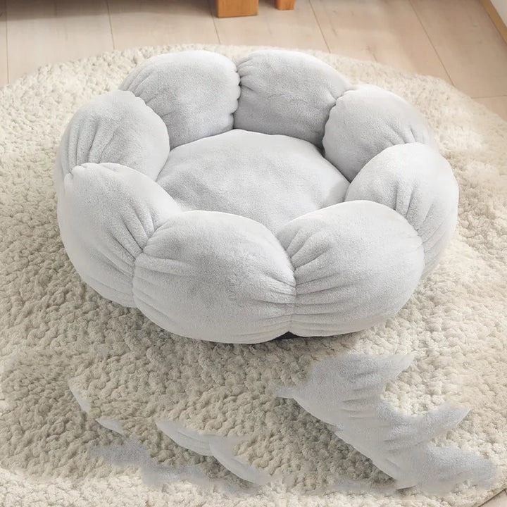 Comfortable flower cat bed, designed as a cozy pet relaxation spot. Soft feline furniture accessory.
