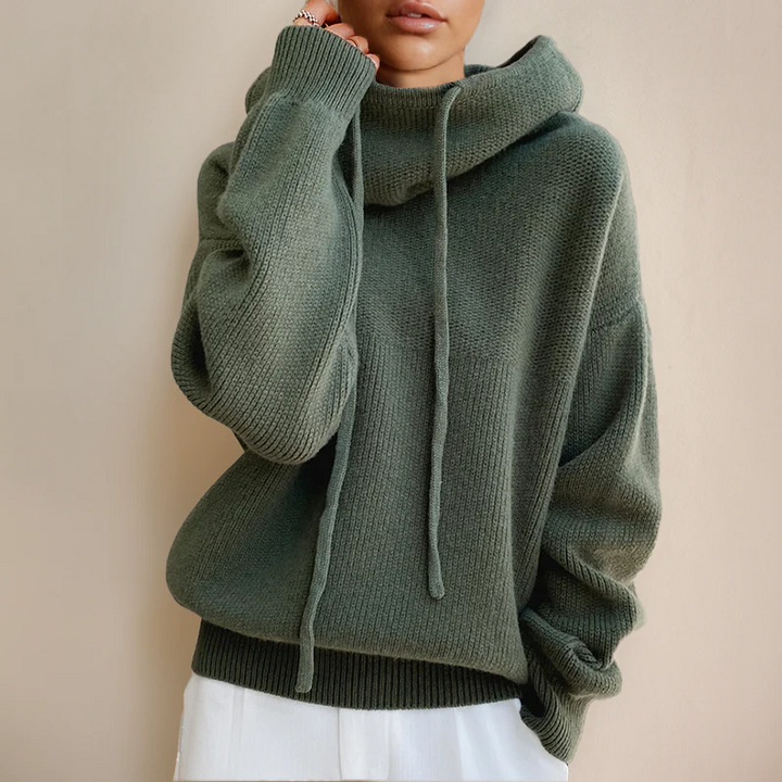 Stylish women's hooded sweater in a soft knit, great for everyday comfort and casual fall/winter wear.