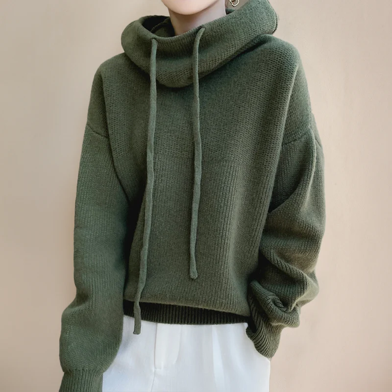Comfortable women's green hooded sweater. A versatile layering piece for cozy relaxed fit fall fashion.