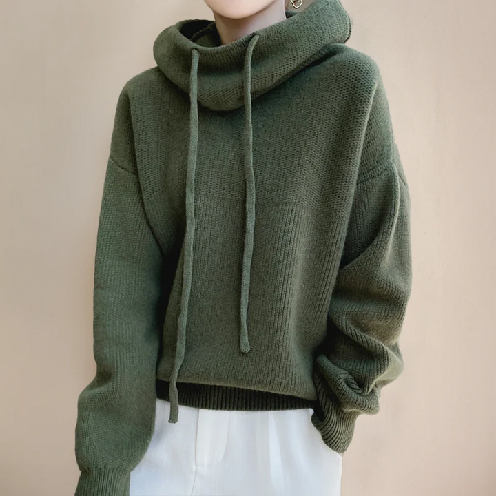 Comfortable women's green hooded sweater. A versatile layering piece for cozy relaxed fit fall fashion.