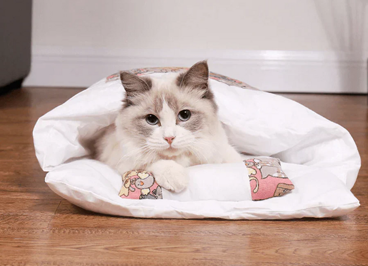 Warm feline sleeping bag cat bed, offering ultimate comfort and a snug retreat for your pet.