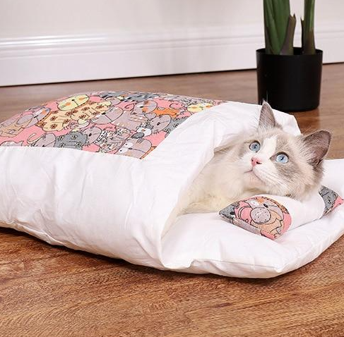 Luxury cozy cat sleeping bag, a soft, warm pet bed designed for ultimate feline comfort & rest.