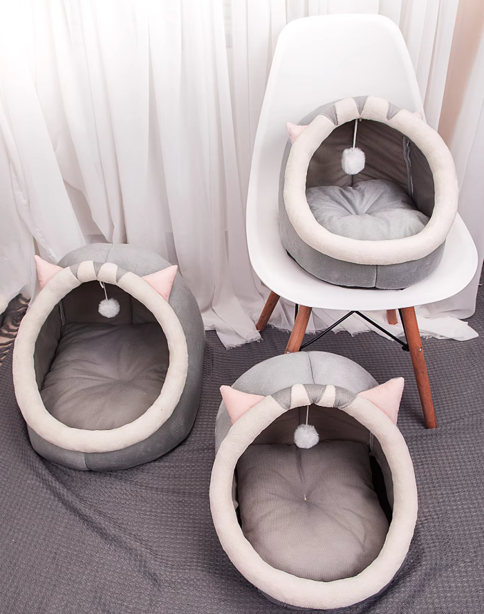 Soft, plush cat igloo bed cave, perfect for a cozy feline hideaway and comfortable sleep.