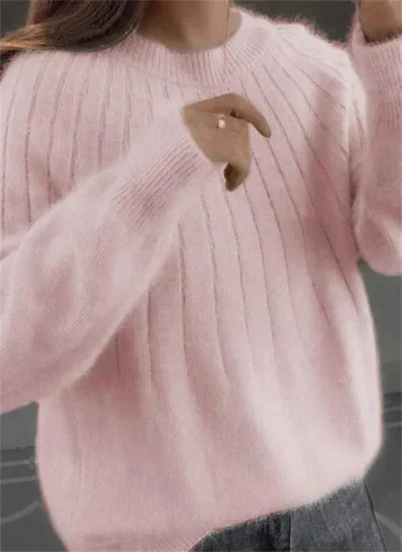Women's fluffy knit pullover sweater in light pink, perfect for fall fashion and cozy layering.