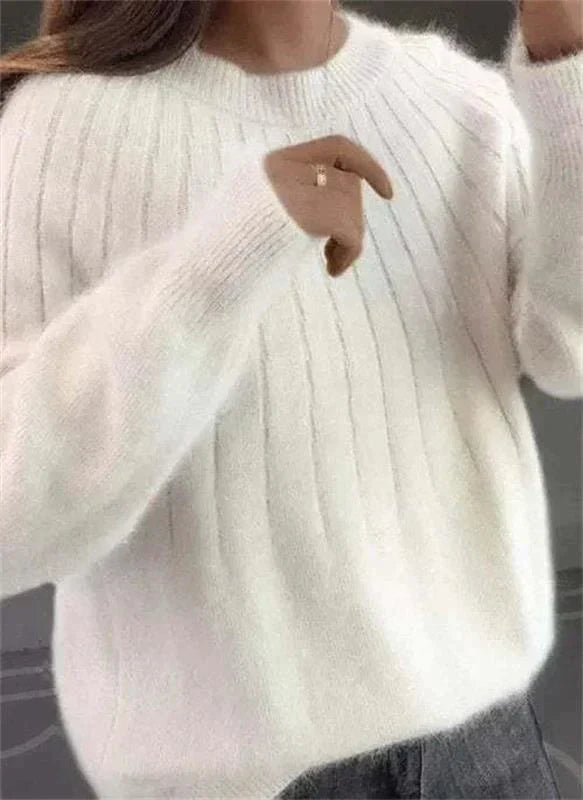 Soft sky blue fluffy knit sweater for women, offering stylish and cozy comfort.