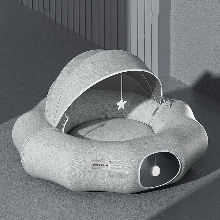 Inviting pet bed for cats & small dogs with a removable roof & built-in toy for play and relaxation.