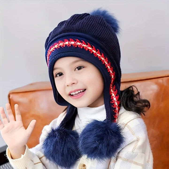 Children's warm winter hat. Knit with ear flaps & a cute pom-pom, perfect for cold weather adventures.