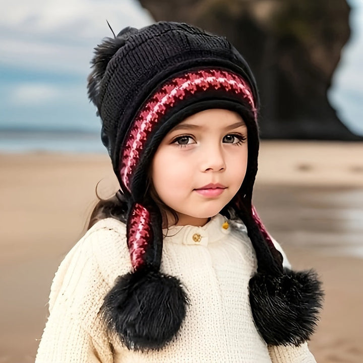 Stylish knit pom-pom hat for kids. Cozy ear flap design keeps toddlers warm in cold weather.