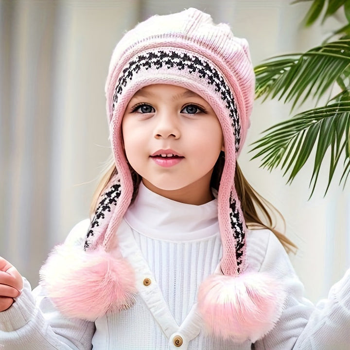 Children's ear flap winter hat, knitted & warm. Features a cute pom-pom; great for toddlers.