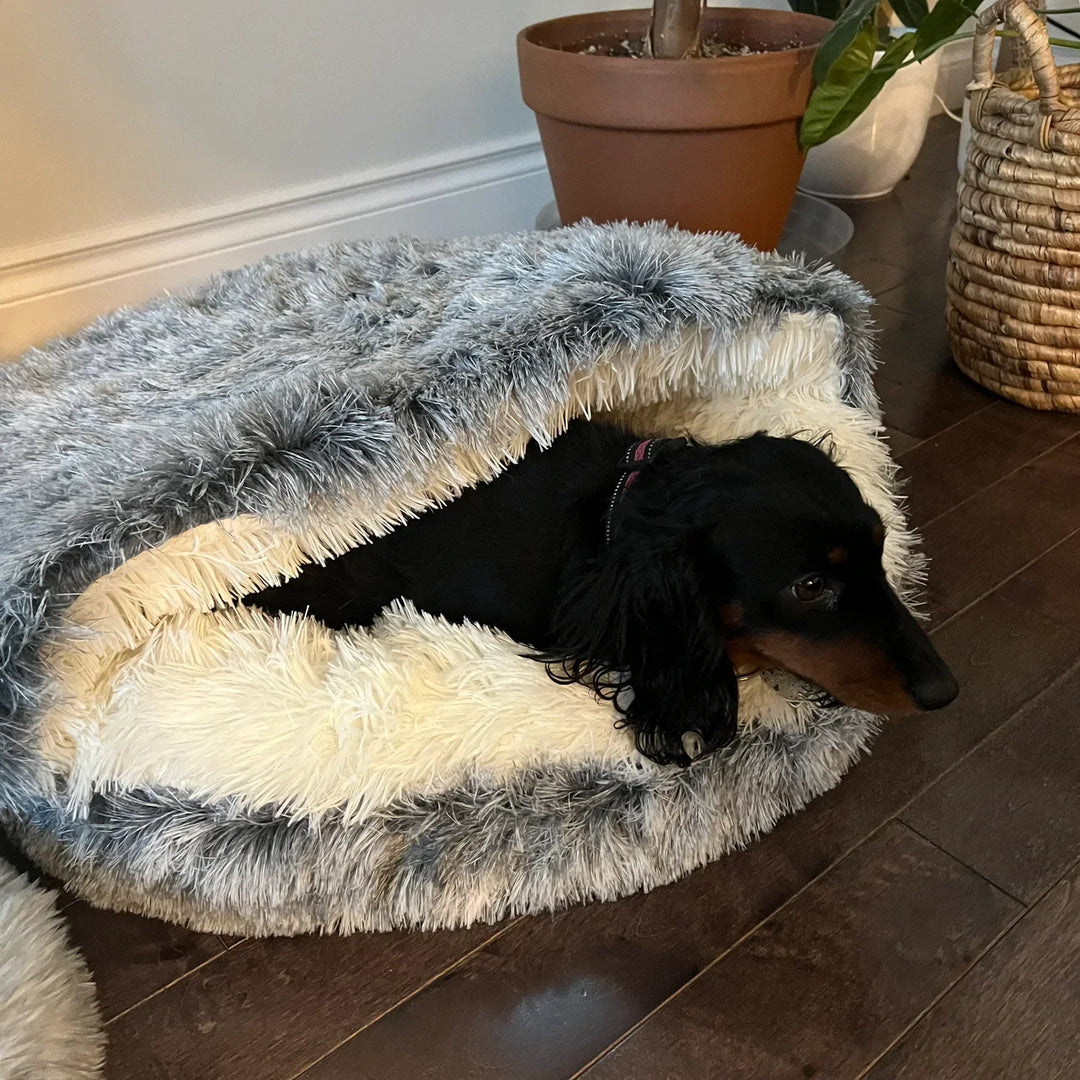 Cozy pink plush pet cave bed for small dogs and cats, offering ultimate comfort.