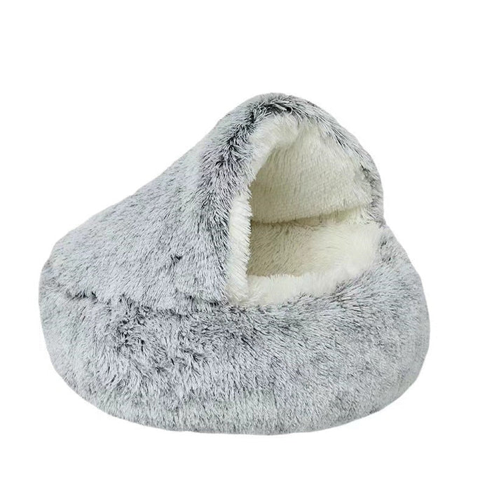 Round coffee-colored plush pet cave bed, providing a warm den for pets.