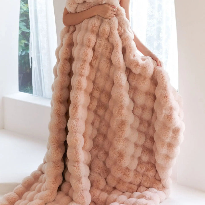 Luxurious soft fleece blanket draped over a sofa for home decor