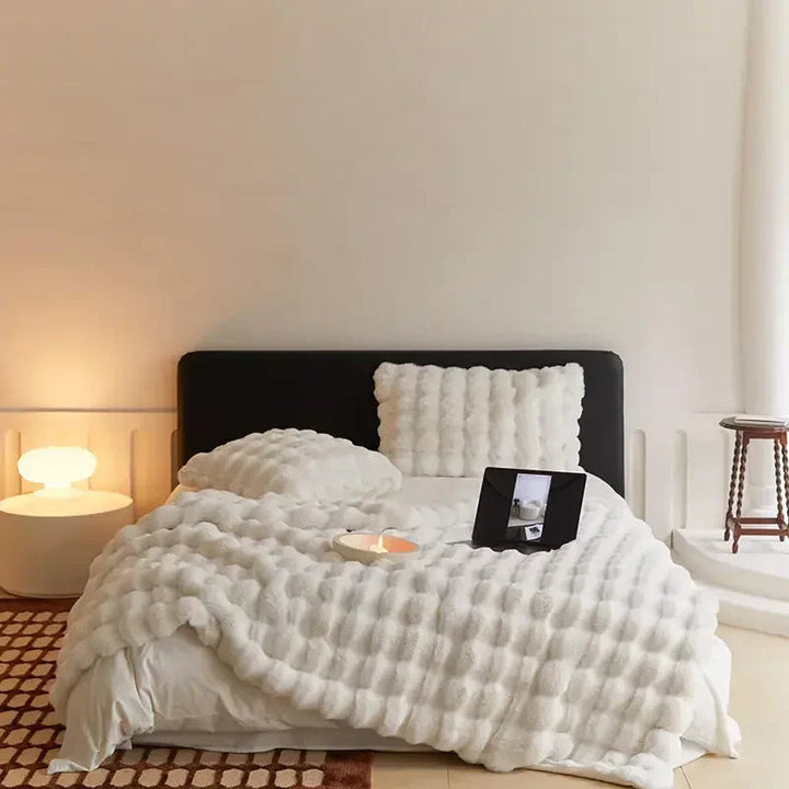 Elegant light grey plush bubble blanket as a stylish bedding addition