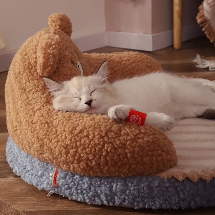 Soft, plush cat bed with cozy back support, perfect for small dogs too. Provides warm, comfortable sleep.