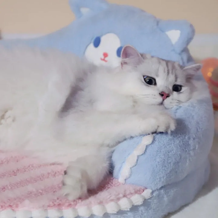 Comfortable pet bed for cats & small dogs. Features a cozy, plush design with soft back support for restful sleep.