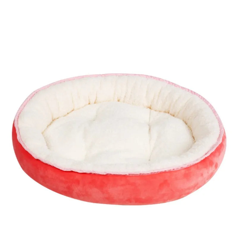 Soft, round faux fur pet bed, perfect for cozy relaxation for cats & small dogs. Luxury animal accessory.