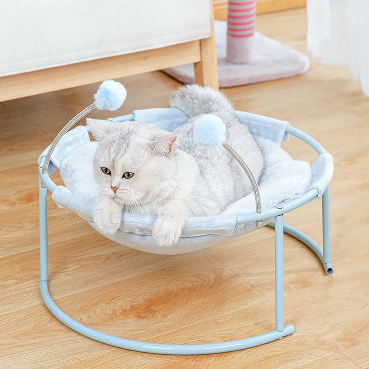Cozy round cat hammock lounger with interactive play balls. Perfect for comfort & fun.