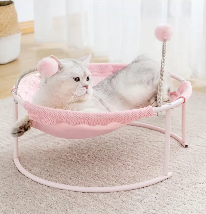 Rosa cat bed hammock, a comfortable & sturdy cat furniture piece with interactive toys.