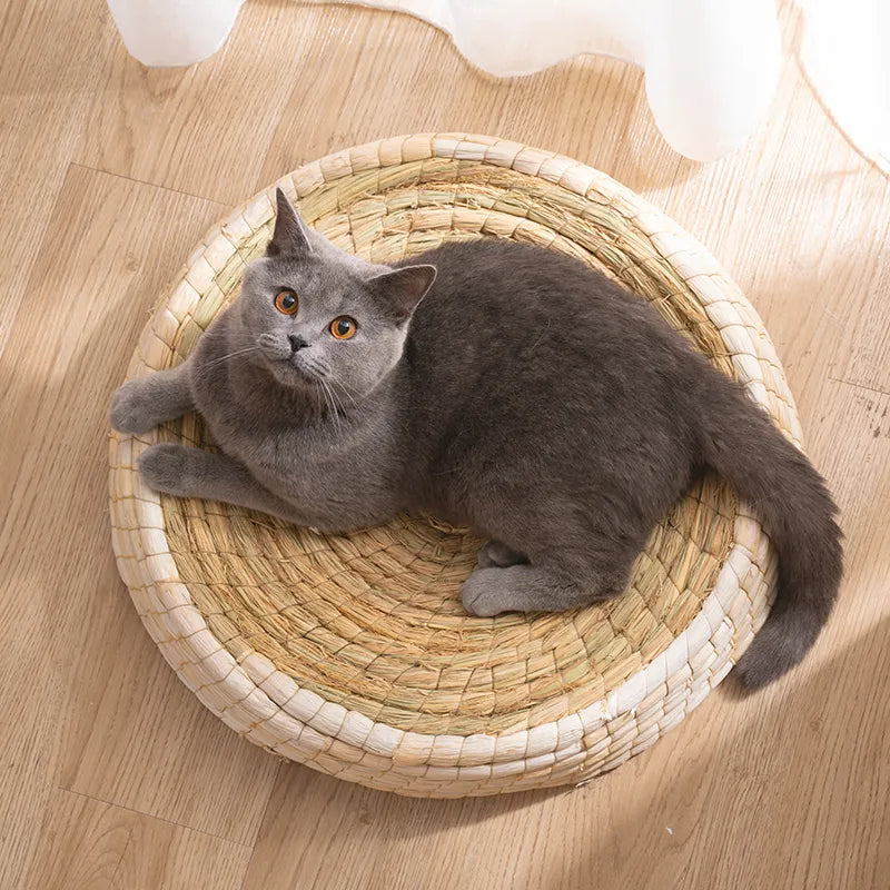 Handmade round cat bed, a plush pet accessory crafted from natural fibers, providing a warm and cozy feline resting spot.