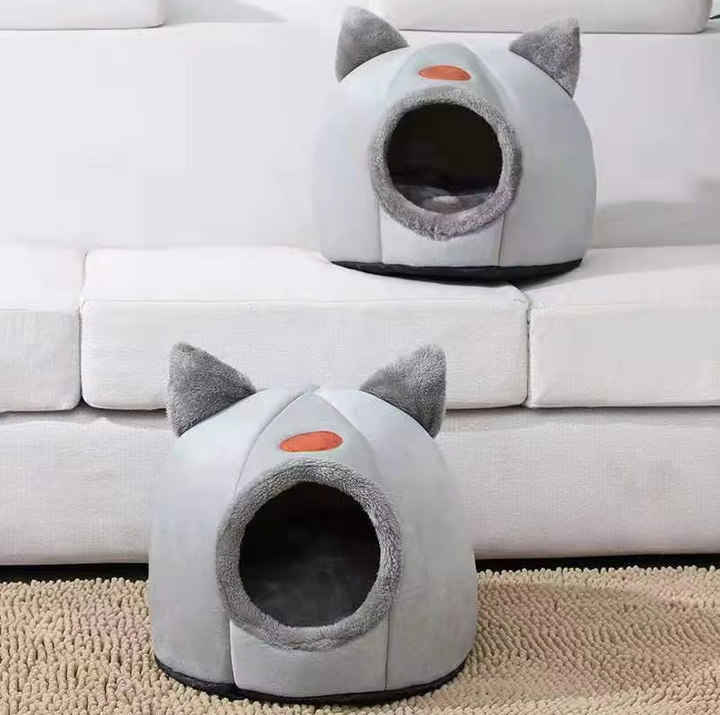 Feline's favorite: a cozy warming cat bed house with a soft, removable cushion for deep, comfortable sleep.