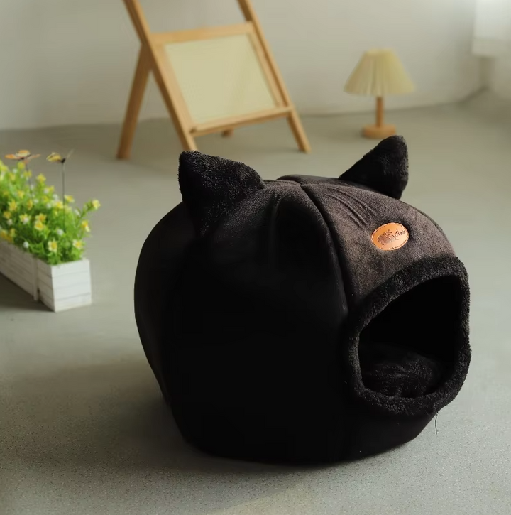 Inviting gray cat house bed, a warming pet sanctuary with a plush, removable cushion for blissful feline sleep.