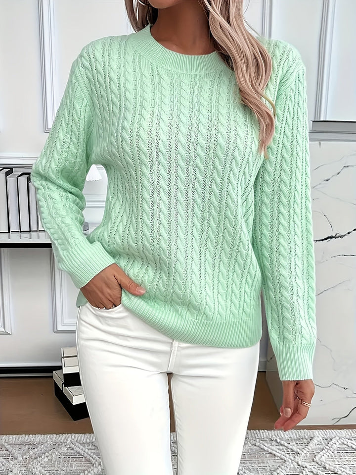 Cozy women's cable knit sweater in a soft blend, perfect for spring or autumn.
