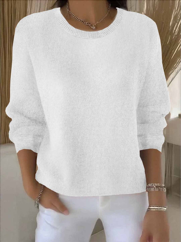Chic women's long sleeve knit sweater, versatile for everyday style and warmth.