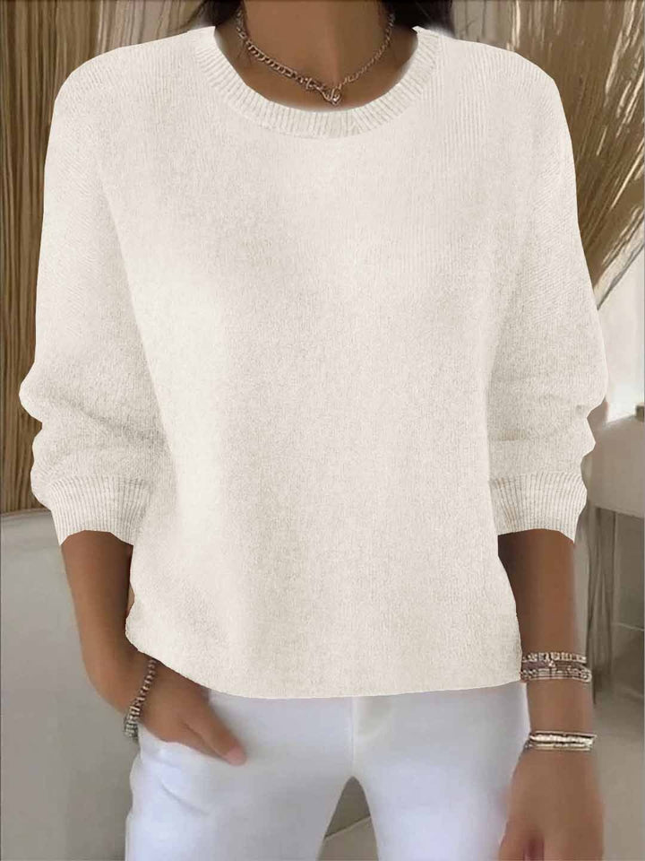 Elegant women's knit jumper in cozy fabric, ideal for autumn & winter outfits.