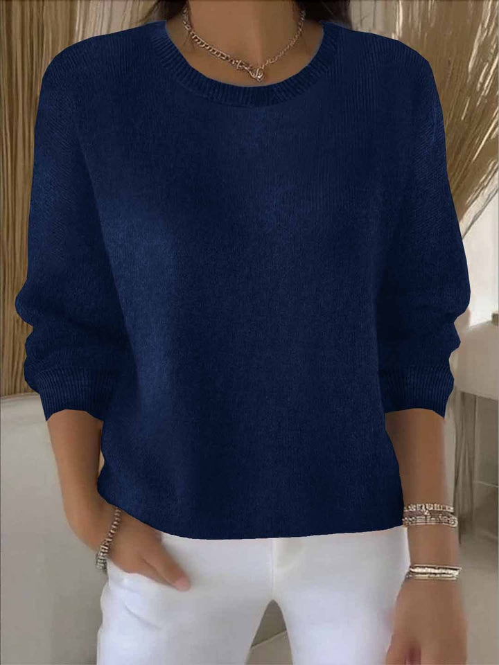 Soft women's long sleeve sweater, offering comfort and chic style for everyday wear.