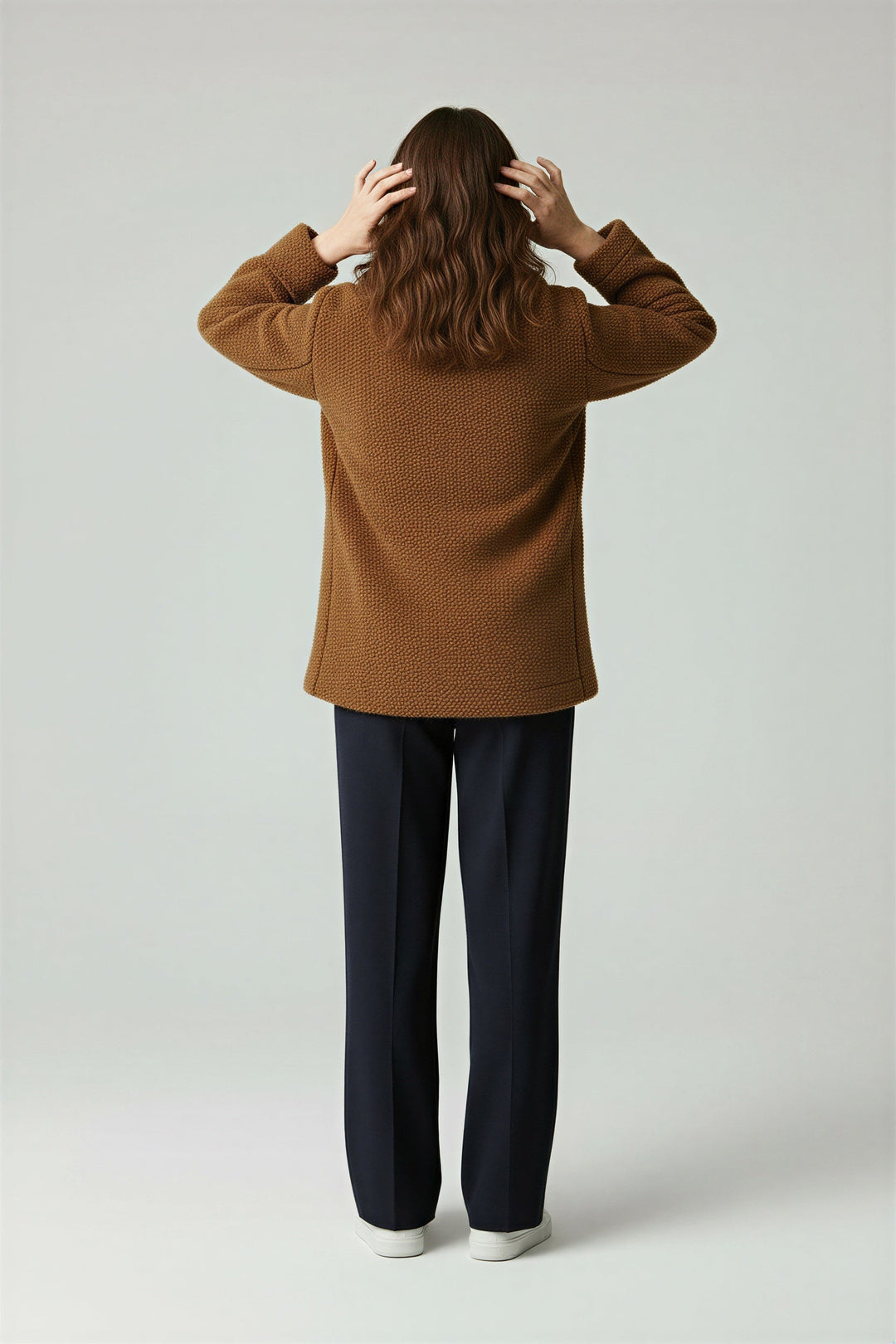 Model wearing the women's sherpa coat for a stylish, comfortable look.