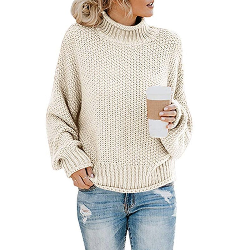 Cozy women's oversized turtleneck sweater for winter fashion. Loose fit, comfortable long sleeve pullover.