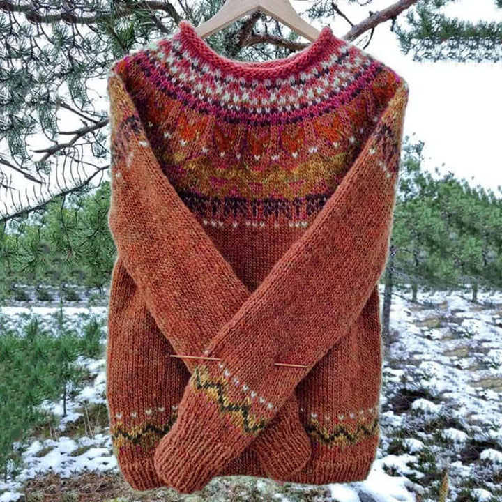 Woman wearing a cozy knit winter sweater, a warm & stylish pullover perfect for cold weather fashion.