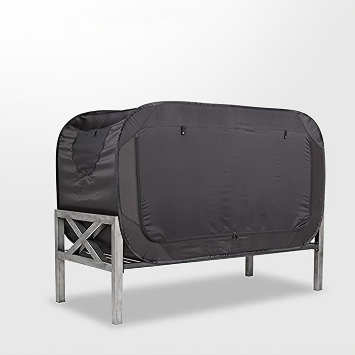 Compact CozyNest folding tent bed, ideal for camping trips and backyard adventures.